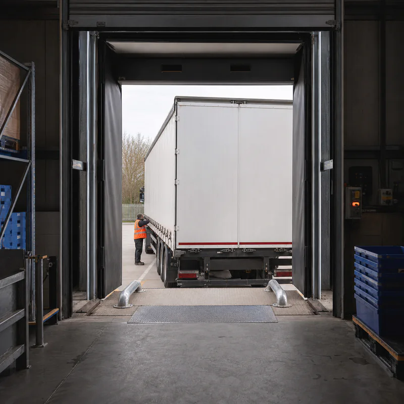 Loading dock with a trailer backed onto the bay